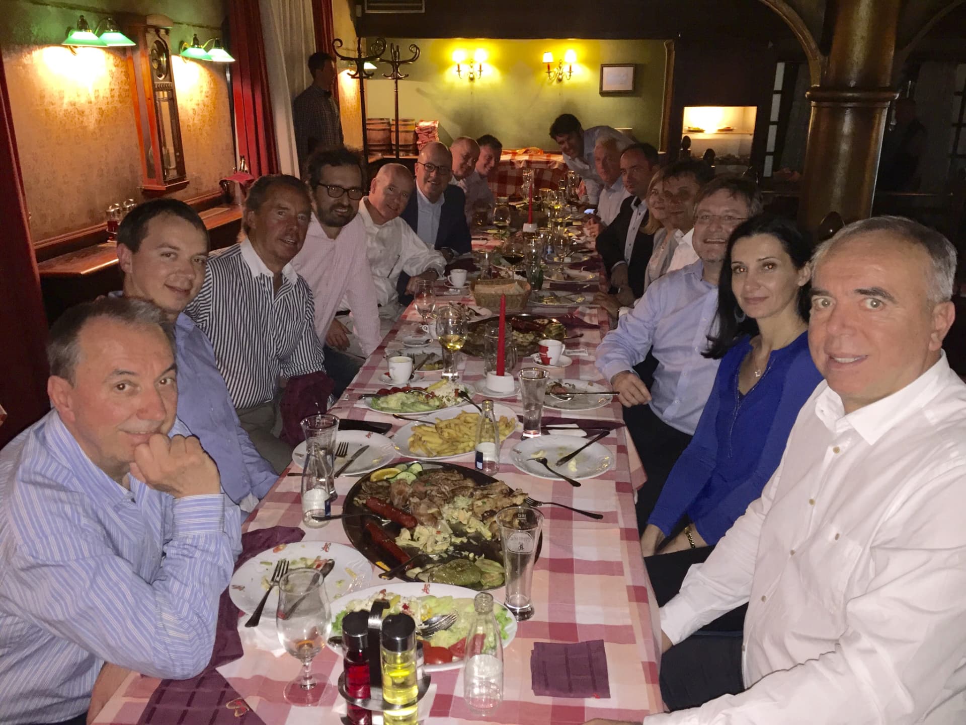 A long table of friends gathered for dinner in the Piedmont