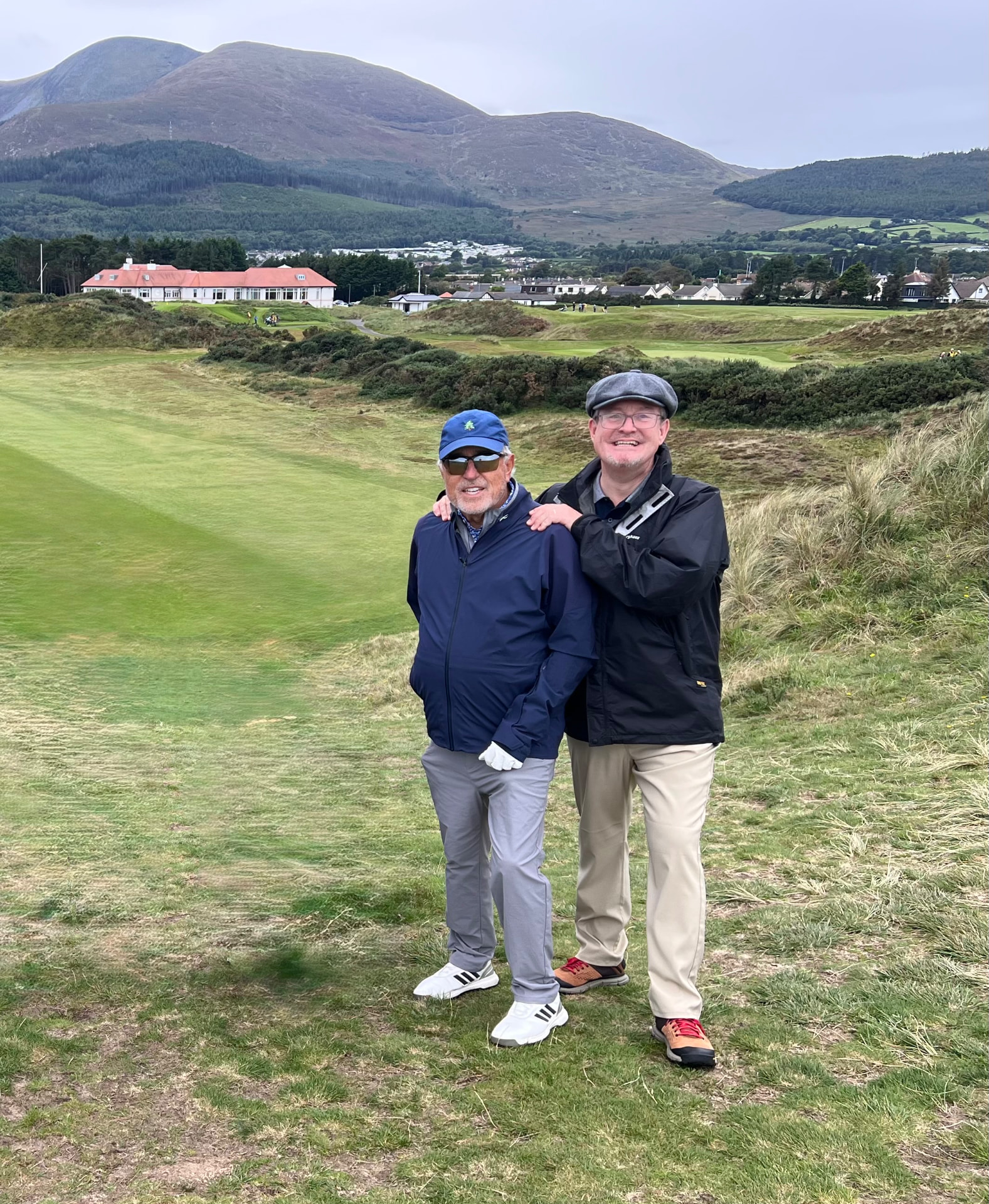 Mark Finlay with Harvey Freeman on a links course beneath the Mourne Mountains