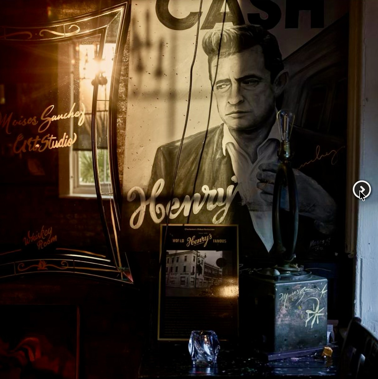 Whiskey Room signage and Johnny Cash artwork at Henry's