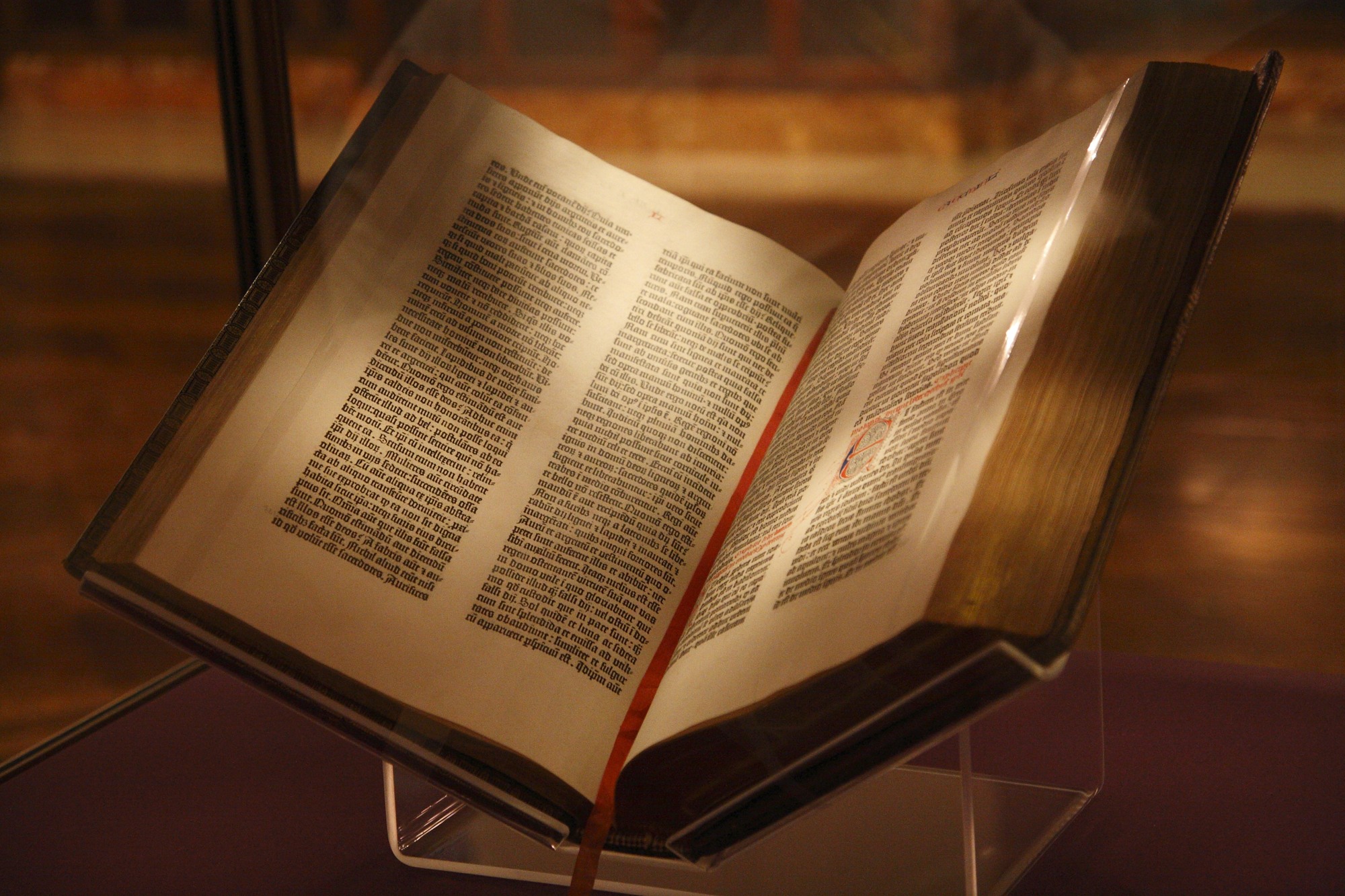 An authentic Gutenberg Bible open on display at the New York Public Library