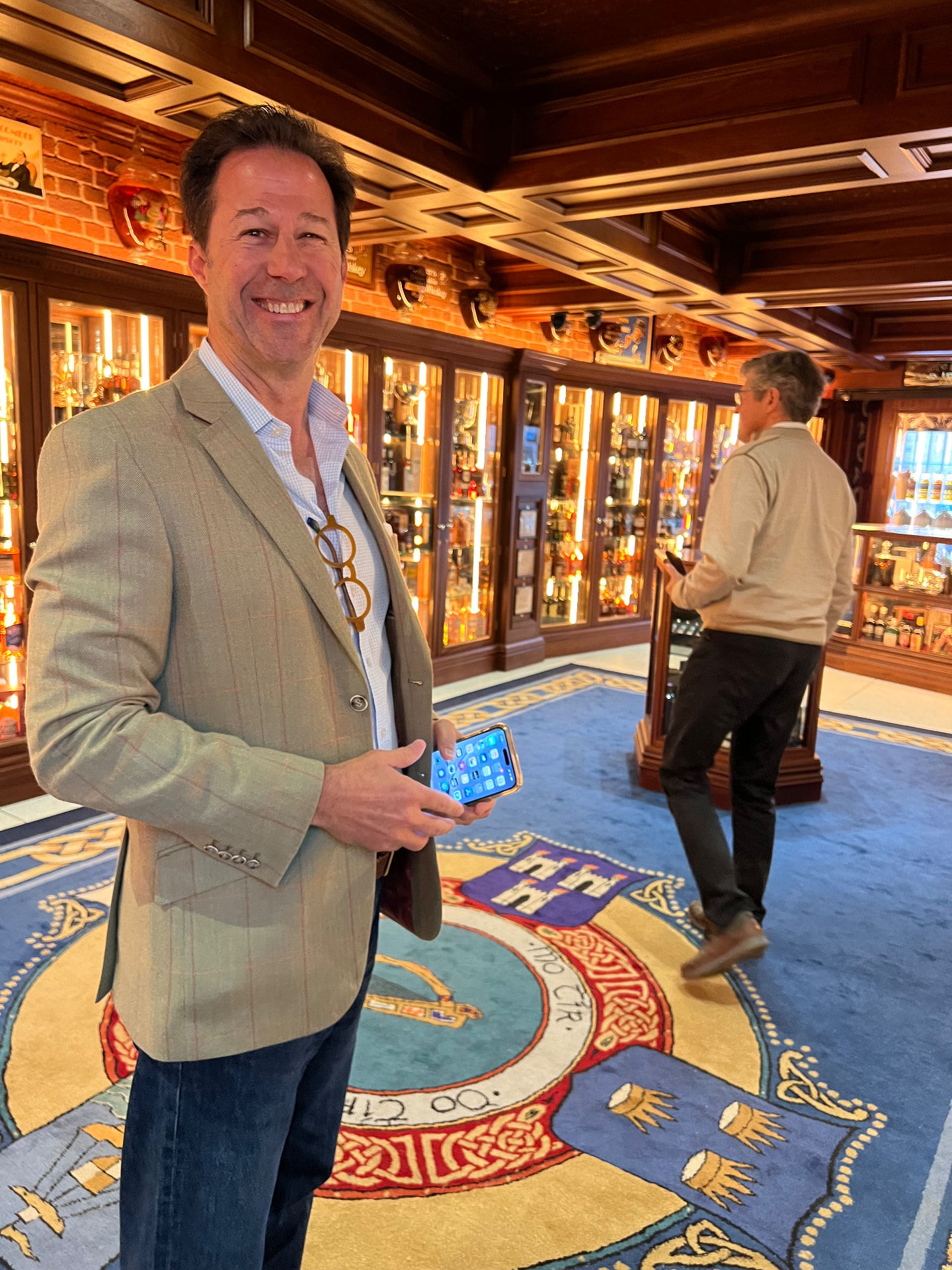 Mark Finlay standing in a wood-panelled Irish whiskey room